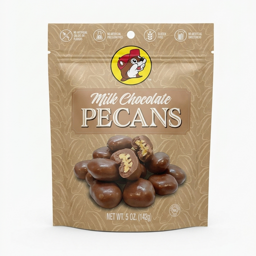 A professional product listing photo of a bag of Buc-ee's Milk Chocolate Pecans on a clean white background. The beige stand-up pouch features the iconic Buc-ee's beaver logo at the top center. Text below reads 'Milk Chocolate PECANS' above a pile of chocolate-covered pecans, two of which are cut in half. Dietary claims are at the top, and 'NET WT. 5 OZ. (142g)' is at the bottom. The lighting is bright and even.