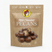 A professional product listing photo of a bag of Buc-ee's Milk Chocolate Pecans on a clean white background. The beige stand-up pouch features the iconic Buc-ee's beaver logo at the top center. Text below reads 'Milk Chocolate PECANS' above a pile of chocolate-covered pecans, two of which are cut in half. Dietary claims are at the top, and 'NET WT. 5 OZ. (142g)' is at the bottom. The lighting is bright and even.