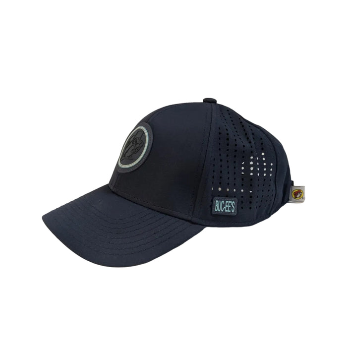 An angled side view of the navy blue performance cap, showcasing the clean curve of the brim and the laser-perforated ventilation holes that cover the side panels for cooling airflow.
