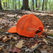 Stand out and stay safe in the great outdoors with the Buc-ee’s Orange Hunter Hat. This high-visibility trucker cap features a bright fluorescent orange color that’s perfect for hunting, hiking, or any adventure where you want to be seen. The front panel sports a bold Buc-ee’s oval logo in black with stars for a classic, rugged look, while the mesh back keeps things cool and breathable. With an adjustable snapback closure, this hat fits most head sizes comfortably.