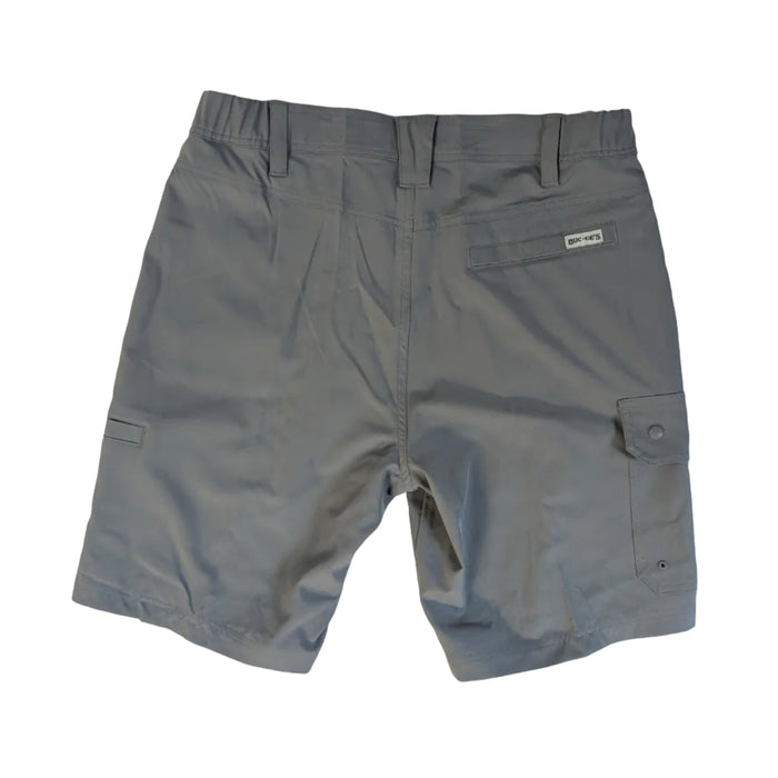 Back view of a pair of grey Buc-ee’s Night Owl Fishing Cargo Shorts laid flat on a white surface. The image shows an elasticized waistband with belt loops, a single welt back pocket featuring a small white Buc-ee’s logo tab, and a side cargo pocket with a snap-button closure. The fabric has a smooth, matte finish.