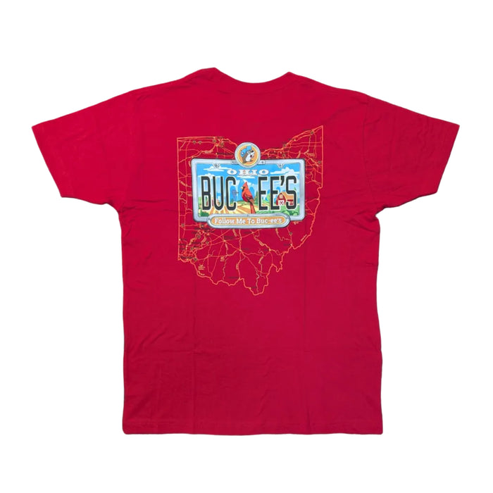 Back view of the Buc-ee's Ohio License Plate Red Shirt, a red t-shirt featuring a large graphic. An orange outline of the state of Ohio serves as the backdrop for a custom "OHIO" license plate that says "BUC-EE'S" with a cardinal and farm scene. A small banner below reads "Follow Me To Buc-ee's." Displayed on a clean white background.