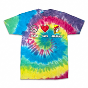 A colorful rainbow spiral tie-dye short-sleeve t-shirt laid flat against a white background, featuring three graphic icons across the chest: a peace sign, a red heart, and a yellow silhouette of Alabama with the Buc-ee's beaver mascot.