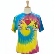 Tie-dye t-shirt with peace, love, and art designs on a mannequin in a store setting.