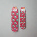 Two pairs of Buc-ee’s Peppermint Christmas Crew Socks, one kids’ size and one adult size, featuring a red background with candy canes, peppermints, and Buc-ee’s logos.