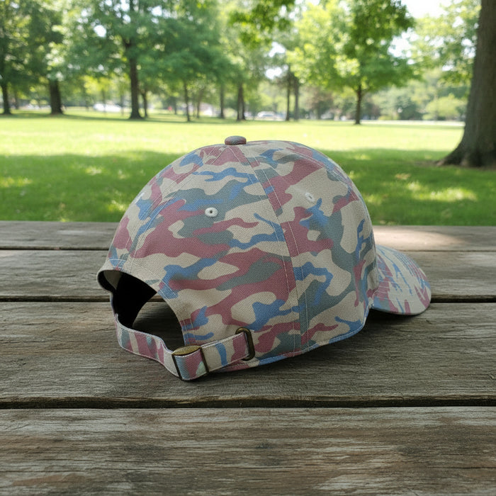 Side and back view of a pink camouflage Buc-ee’s baseball cap showing the adjustable strap and multicolor camo pattern.