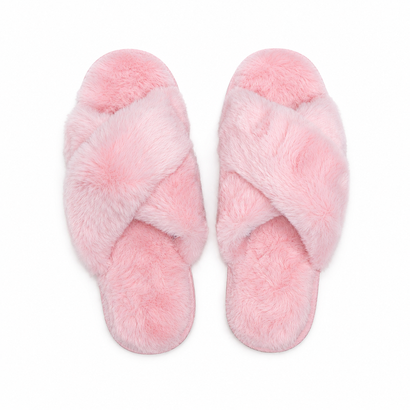 A pair of Buc-ee's pink furry slippers with fluffy faux-fur crisscross straps and matching soft footbeds, displayed side by side on a clean white background.