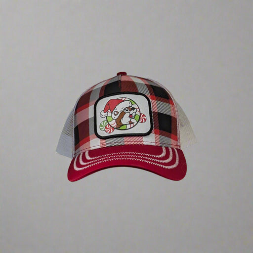 The front has a plaid design with the Buc-ee's logo in a santa hat with green and red peppermint candies. The bill of the hat is red with white stitching and the back is a mesh white trucker style. 