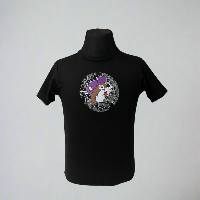 Buc-ee's "Put a Spell on Me" Halloween Shirt has a Buc-ee on the from surrounded with a spiderweb and he is wearing a purple hat. 