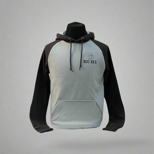 Buc-ee's Raglan Hoodie has a light gray body with black sleeves. It has a small Buc-ee's logo in the top left corner with the words Buc-ee's right under it. 