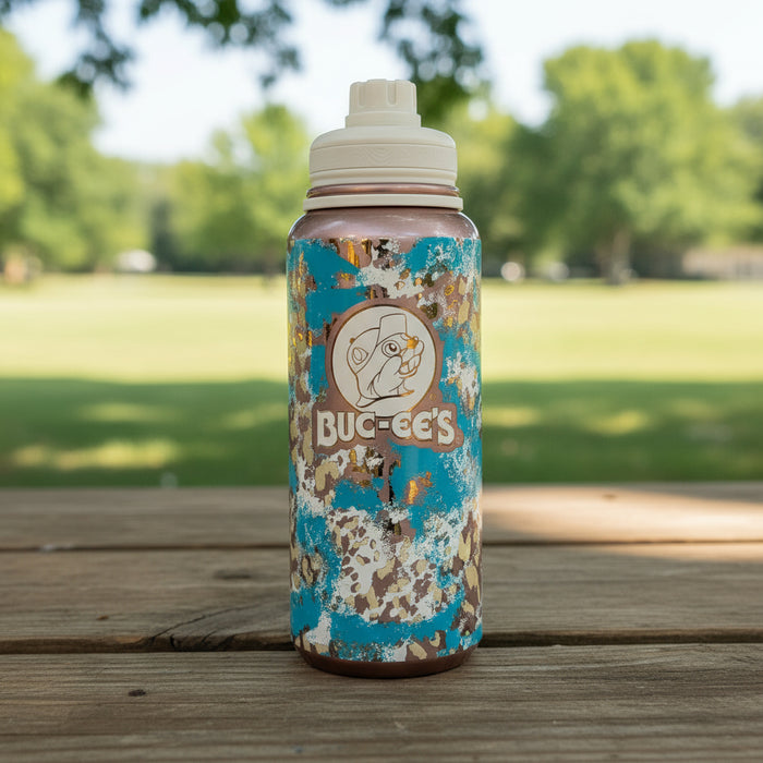 stainless steel bottle features a unique turquoise, tan, and cream leopard print design that brings a little western flair wherever you go. The front proudly displays the classic Buc-ee’s logo, making it a must-have for any fan of the Beaver.