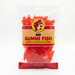 A clean product listing image featuring an 8 oz bag of Buc-ee’s Red Gummi Fish centered on a solid white background. The clear, resealable bag shows the iconic yellow Buc-ee's logo above bold black and red text reading "RED GUMMI FISH." The packaging is filled with bright red, fish-shaped gummy candies.