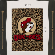 Close-up of a Buc-ee’s leopard-print blanket packaging label showing the blanket design with Buc-ee’s beaver logo and dimensions of 50 inches by 70 inches.