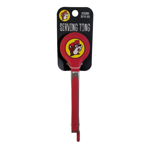 The Buc-ee's serving tongs mounted on their official black cardboard retail backing which reads 'DESIGNED IN THE USA' and 'SERVING TONG' with a mini beaver logo.