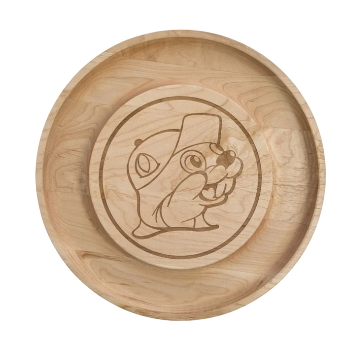 Top-down view of a Buc-ee's Round Cheese Board, a round maple wood cheese board featuring a laser-etched Buc-ee's logo in the center. Displayed on a clean white background.
