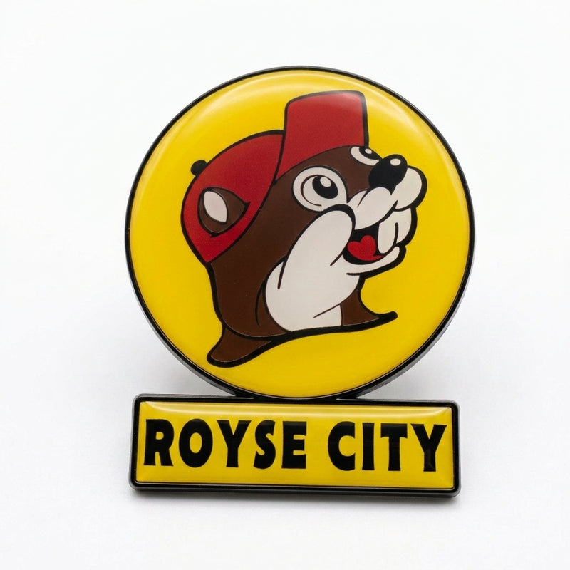 A circular yellow souvenir fridge magnet shaped like a Buc-ee's highway billboard sign on a solid white background. It features the smiling beaver mascot logo in a red cap inside a yellow circle, mounted over a rectangular yellow bar that reads "ROYSE CITY" in bold black lettering.