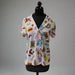 Buc-ee’s Snacks Pajama Top on a mannequin, featuring colorful snack-themed print with Buc-ee’s logo and button-up design.