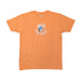 An orange short-sleeve crew neck t-shirt laid flat on a white surface. The front of the shirt features a small, centered chest graphic showing a white highway shield outline containing the Buc-ee's beaver mascot in a blue baseball cap, with the text "Buc-ee's South Carolina" curved beneath it.