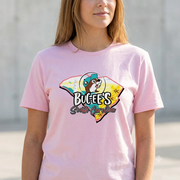 A close-up of a woman wearing a Buc-ee's South Carolina State Map light pink t-shirt. The shirt features a graphic combining the outline of the state of South Carolina with a coastal scene. Superimposed on the map is a circular logo with the Buc-ee's beaver mascot wearing a teal cap. The text "Buc-ee's South Carolina" is printed below the mascot logo.