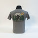 The Buc-ee’s “Spotted at Buc-ee’s” Shirt captures the legendary moment Bigfoot was seen grabbing snacks under the Texas stars. Featuring a classic gray tee with a bold Buc-ee’s logo on the front and a mysterious Bigfoot silhouette against a moonlit forest on the back, this shirt is perfect for fans of roadside adventures and tall tales alike.