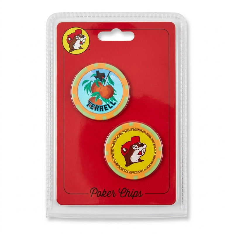 A packaged two-piece Buc-ee's poker chip set on a red backing card. The top chip features a peach graphic with the word "TERRELL", and the bottom chip features the yellow Buc-ee's beaver logo surrounded by a gold glitter border.