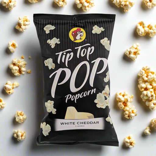 Buc-ee's Tip Top Pop White Cheddar Popcorn bag surrounded by popcorn