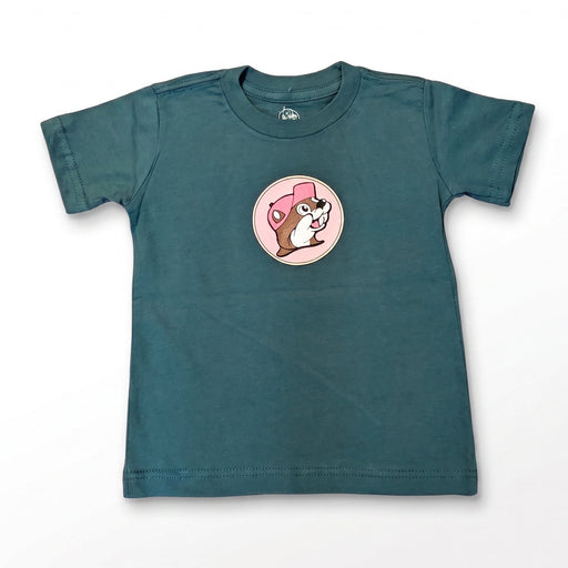 A dark teal green short-sleeve kids' t-shirt with a circular graphic of a cartoon dog wearing a pink hat on the chest, displayed flat against a white background.