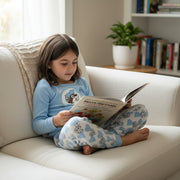 Bedtime just got a whole lot cuter. This Buc-ee’s Toddler Snow Leopard Pajama Set features a soft long-sleeve top paired with comfy matching pants — perfect for snuggly nights and lazy mornings. The top shows Buc-ee wearing a cozy winter hat surrounded by little hearts, while the pants bring the full blue-and-white snow leopard heart pattern to life.