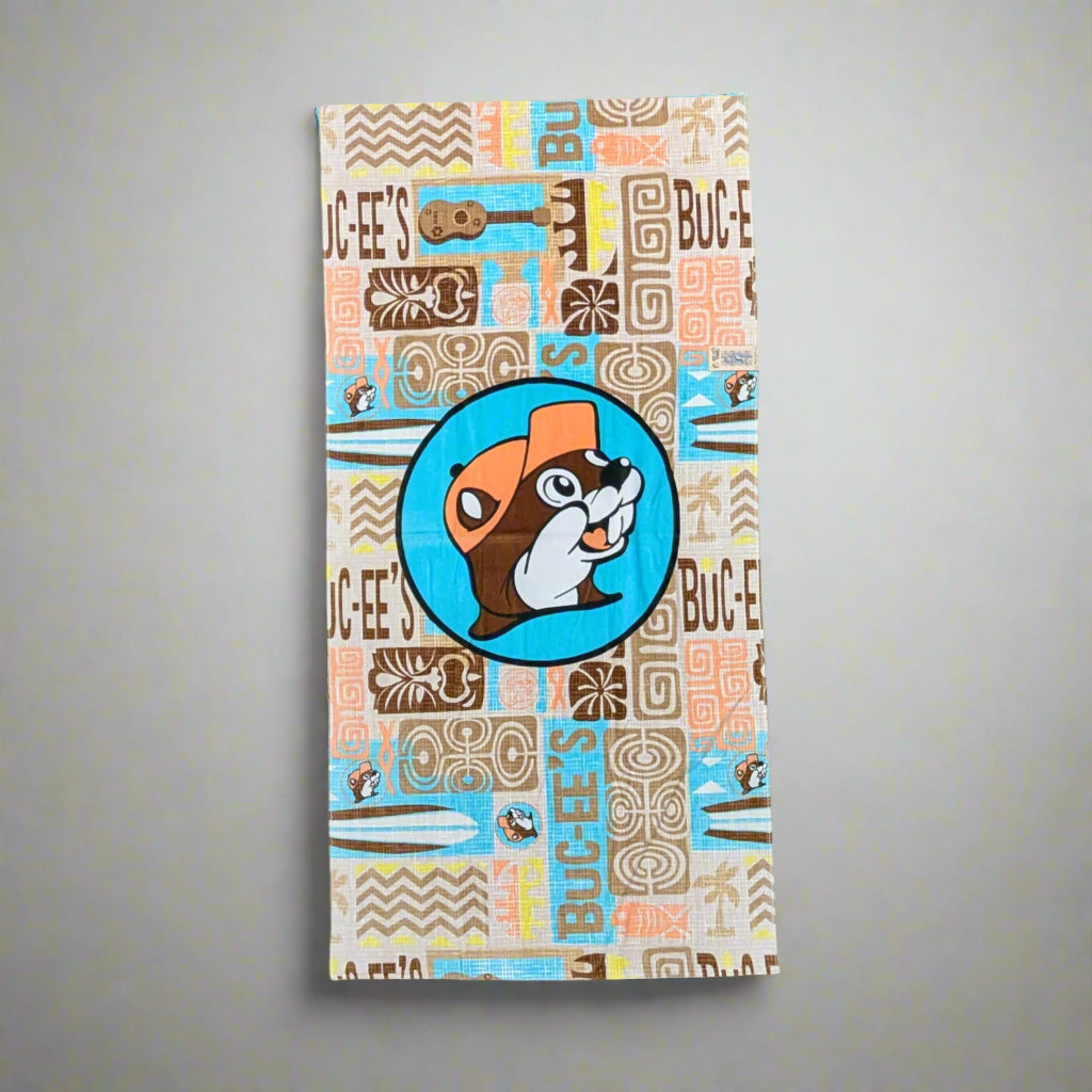 Buc-ee's Hawaiian style towel with brown and teal and peach coloring.