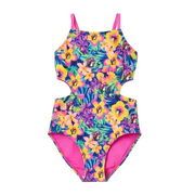A girl’s one-piece swimsuit featuring a vibrant tropical print of pink, yellow, and purple hibiscus flowers and the Buc-ee’s beaver mascot in a pink hat on a blue floral background, designed with trendy side cut-outs, bright pink straps, and a matching pink interior lining, displayed on a clean white background.