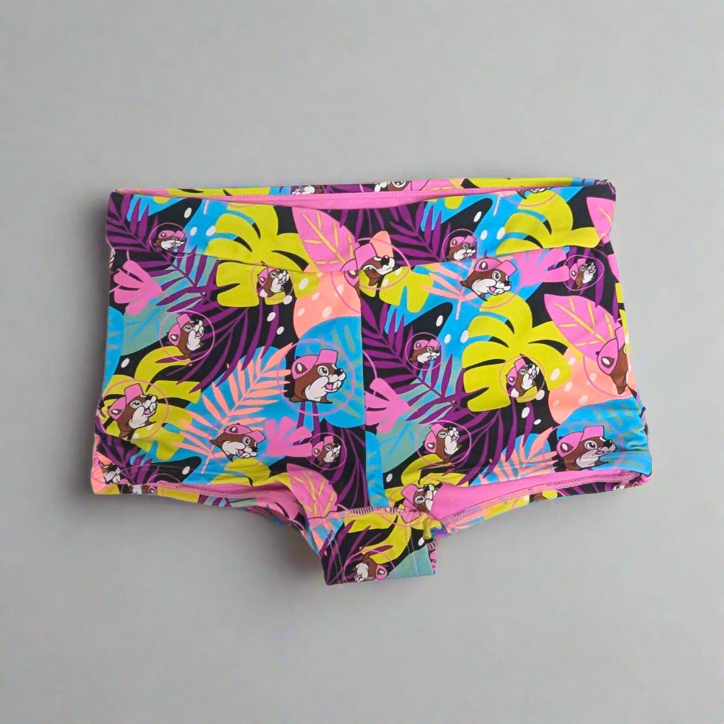 Buc-ee's Tropical Swim Bottoms lots of colorful palm leaves along with Buc-ee's logo. 