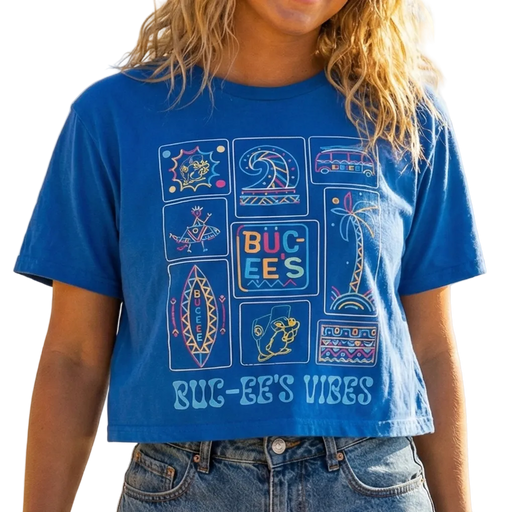 Woman wearing a blue graphic t-shirt on a beach