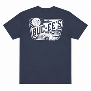 Back view of a navy blue Buc-ee’s T-shirt featuring a large distressed white vintage graphic with bold “BUC-EE’S” lettering, “EST. 1982,” a beaver emblem, stars, and a classic pickup truck, displayed on a clean white background.