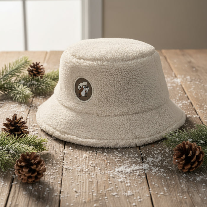 This soft, cream-colored bucket hat is made from plush sherpa fleece that keeps you warm while adding a trendy textured look. The front features the classic Buc-ee’s logo patch, making it the perfect mix of comfort and Texas pride.