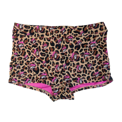 A pair of Buc-ee's Leopard swim shorts. Boy-short style swim bottoms. They feature a full leopard print pattern with pink Buc-ee's beaver icons throughout. The shorts have a thick, supportive waistband and a bright pink interior lining that peeks out along the bottom hem and waist, displayed on a clean white background.