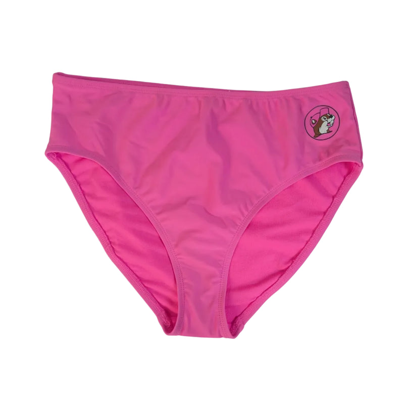 A flat-lay photo shows a pair of Buc-ee's Women's Pink Logo Mid Rise Swim Bottoms. The design features a smooth, athletic fit with moderate coverage and a small, circular Buc-ee’s beaver logo on the upper left hip. The piece is displayed against a clean white background.