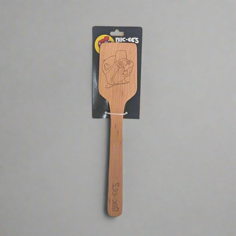 Buc-ee's Wooden Spatula. Large wood spatula with the Buc-ee's logo on the head of it. 