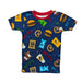 A product photograph of a Buc-ee's youth short-sleeve pajama top centered on a clean white background. The dark blue shirt features a bright red crewneck collar and an all-over cartoon print of Buc-ee the Beaver alongside iconic road trip treats, including Beaver Nuggets bags, beef jerky, sliced brisket sandwiches, gummy bears, pretzels, and fountain drinks.