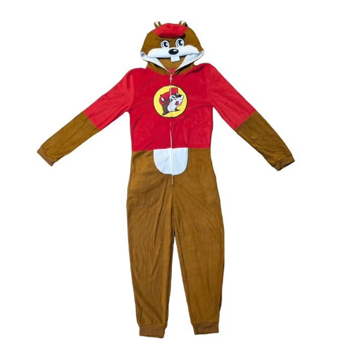 A full-length, front-view studio shot of a Buc-ee's youth union suit against a white background. The one-piece fleece pajama features a red upper chest with the iconic beaver logo in a yellow circle, brown long sleeves and legs, and a white belly patch. The hood is designed as a character head with the beaver's face, buck teeth, and a red cap.