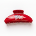Hair clip with Buc-ee design on a white background