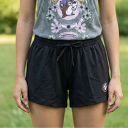 Person wearing a tank top with a graphic design outdoors
