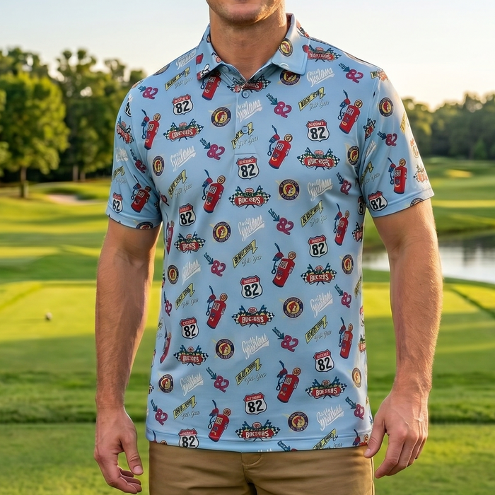 Man wearing a patterned shirt standing on a golf course