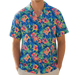 Man wearing a colorful floral shirt on a beach with palm trees.