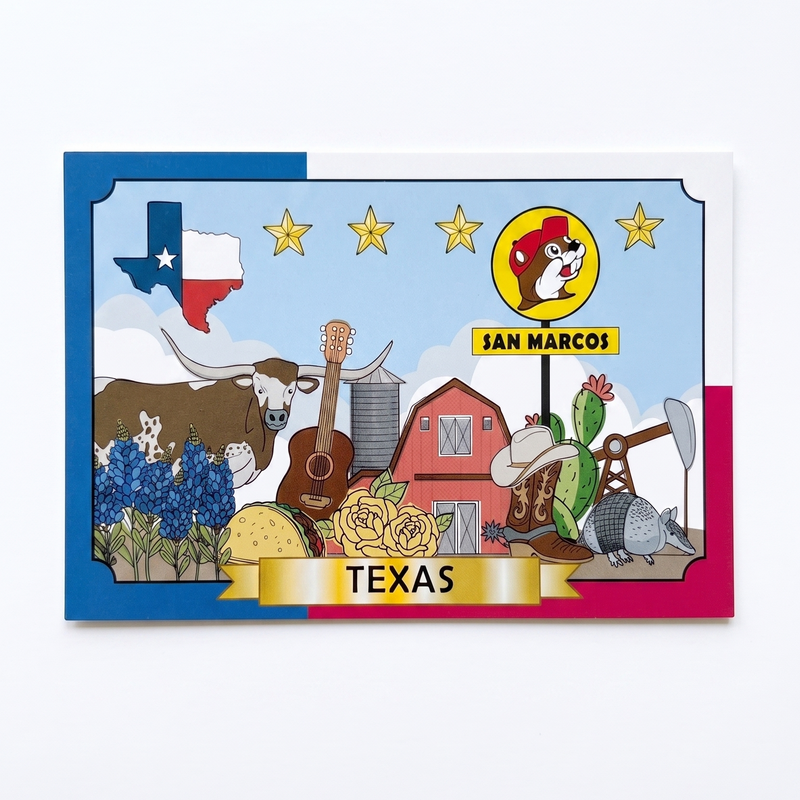 A rectangular printed card or poster featuring a colorful Texas-themed illustration with the San Marcos logo, stars, a longhorn, blue flowers, a barn, and the word TEXAS at the bottom, shown against a light gray background.