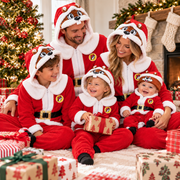Family by a Christmas tree in matching red Buc-ee's Santa union suits