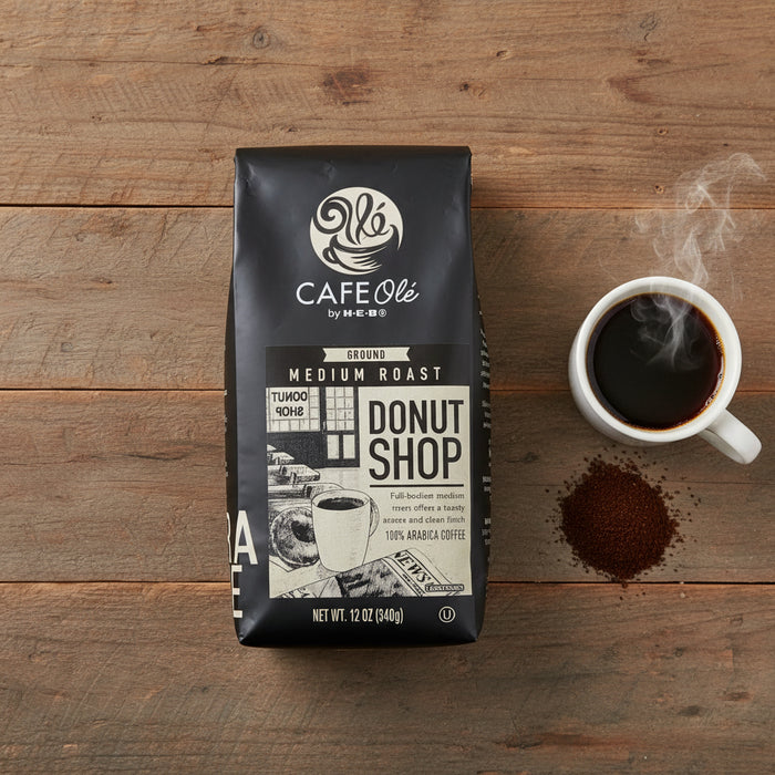 Black coffee bag with 'Donut Shop' branding on a white surface