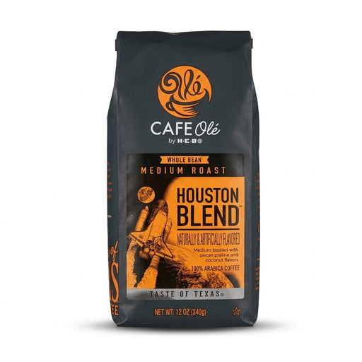 Black 12-ounce bag of H-E-B Café Olé Houston Blend Medium Roast Whole Bean Coffee with an orange label illustrating a space shuttle launching into space.
