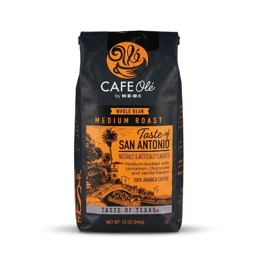 Black 12-ounce bag of H-E-B Café Olé Taste of San Antonio Medium Roast Whole Bean Coffee featuring an orange label with line art of the San Antonio River Walk.