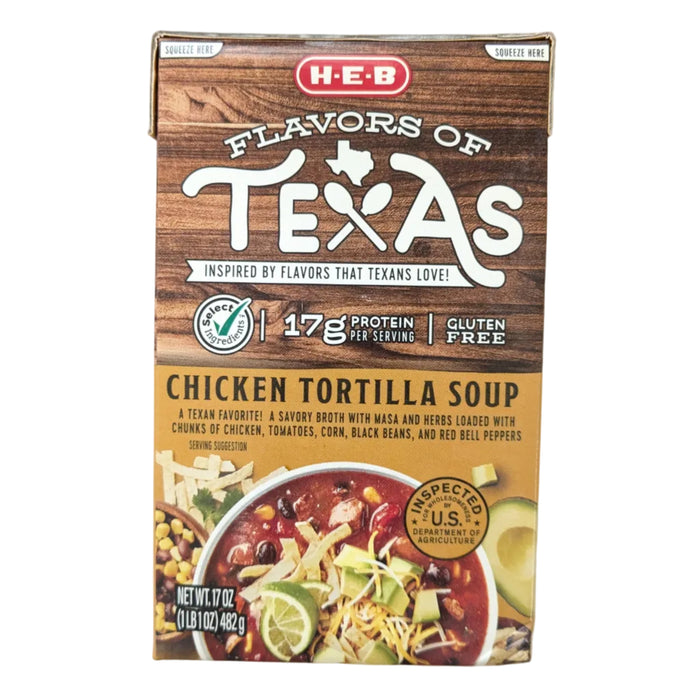 A front-facing carton of H-E-B "Flavors of Texas" Chicken Tortilla Soup against a clean white background. The top half of the carton features a rustic brown wood-grain texture with the "Flavors of Texas" logo. Key product callouts prominently displayed include "Select Ingredients," "17g Protein per serving," and "Gluten Free". The bottom gold-colored label describes the soup as a savory broth with masa and herbs, loaded with chunks of chicken, tomatoes, corn, black beans, and red bell peppers.