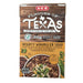 A 17-ounce carton of H-E-B "Flavors of Texas" Hearty Wrangler Soup. The wood-grain upper packaging highlights a "28g Protein per serving" callout and a "Gluten Free" badge. The bottom orange-gold label describes the soup as containing ground beef, Italian sausage, beans, and uncured bacon. A serving suggestion image shows a thick, meaty soup topped with shredded cheese and cilantro.
